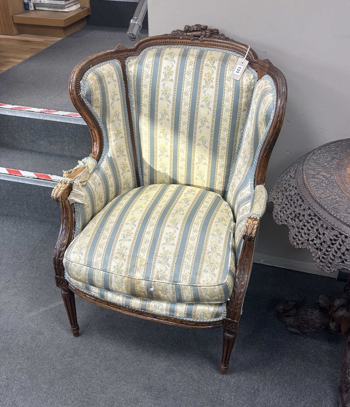 A French carved walnut elbow chair, width 65cm, depth 50cm, height 105cm